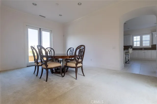 a view of a dining room with furniture and window