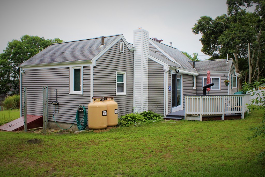 6 Short Neck Road Wareham, MA 02532 - Photo 4 of 17 a front view of a house with a yard