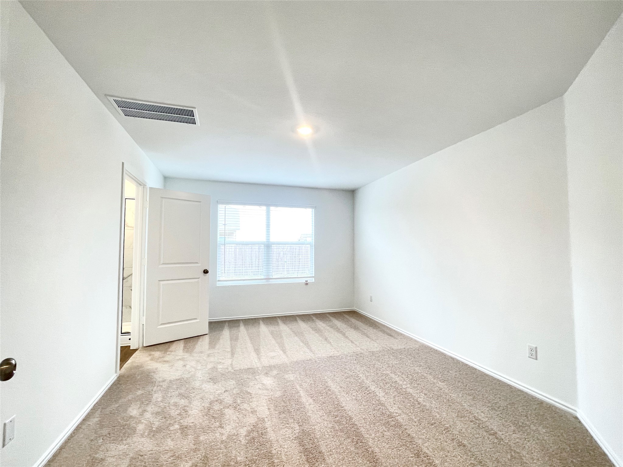 305 Milliner Loop Hutto, TX 78634 - Photo 20 of 36 an empty room with a window