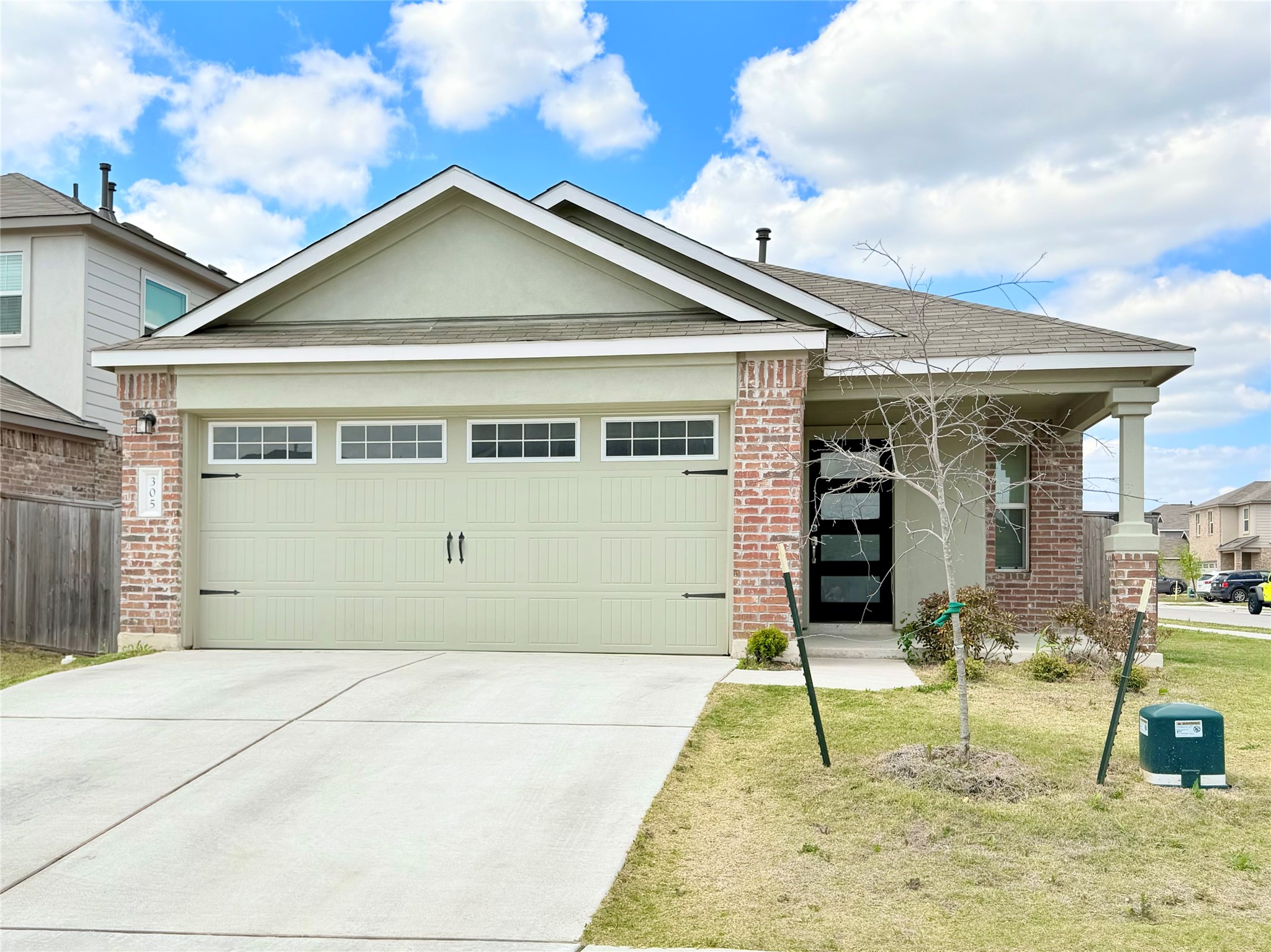 305 Milliner Loop Hutto, TX 78634 - Photo 2 of 36 a view of a house with small yard