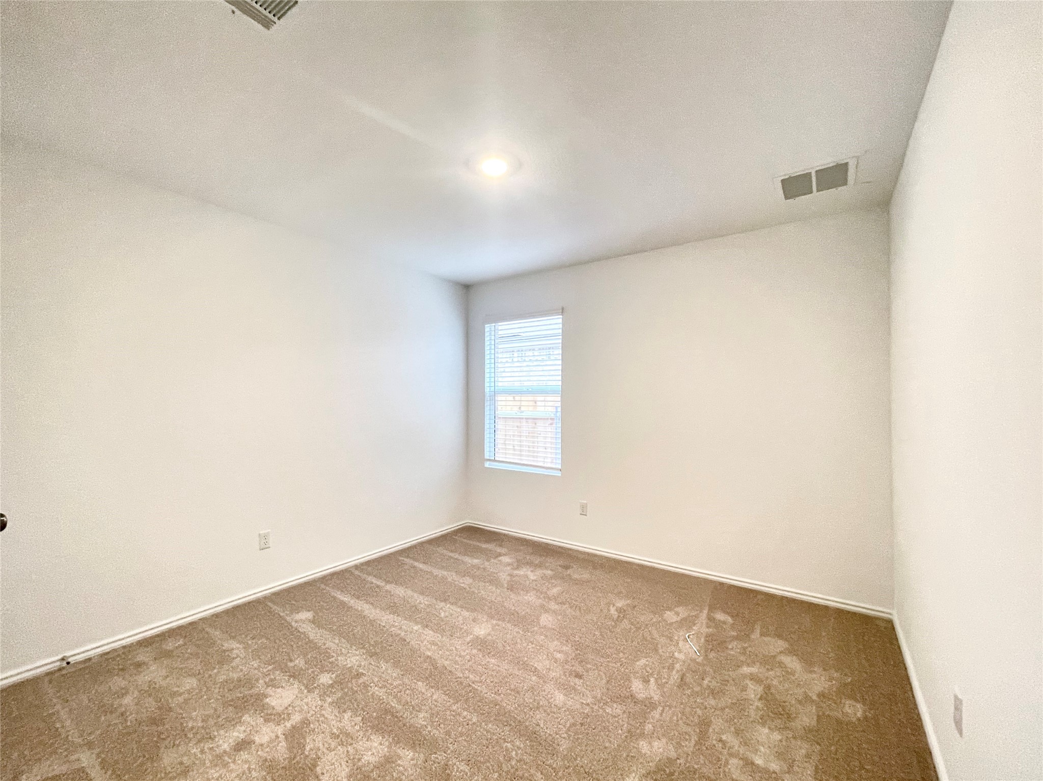 305 Milliner Loop Hutto, TX 78634 - Photo 27 of 36 a view of an empty room