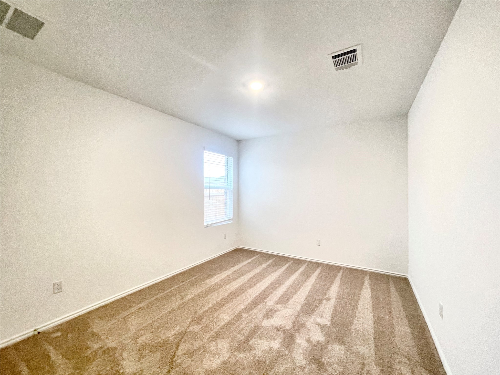 305 Milliner Loop Hutto, TX 78634 - Photo 29 of 36 an empty room with a window