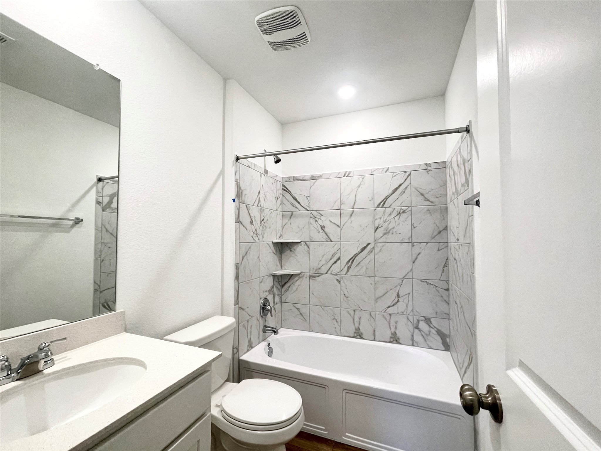 305 Milliner Loop Hutto, TX 78634 - Photo 30 of 36 a bathroom with a granite countertop bathtub shower sink vanity and toilet