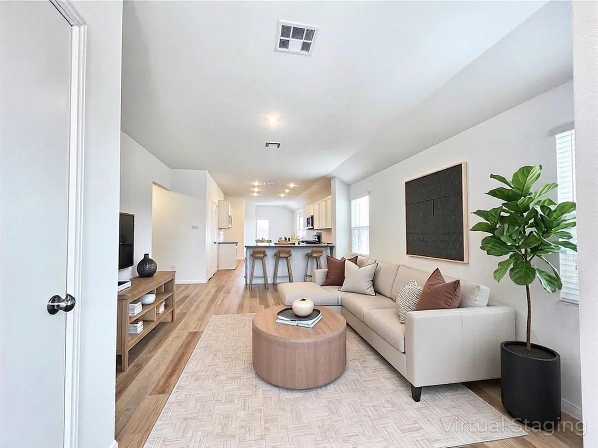 305 Milliner Loop Hutto, TX 78634 - Photo 6 of 36 a living room with furniture and a potted plant