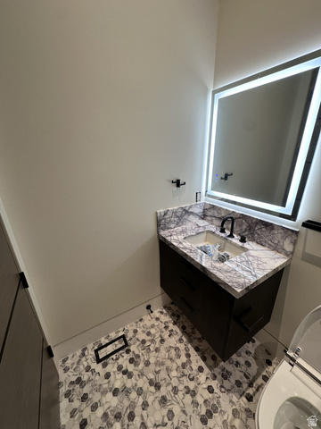 1918 Chimney Rock Road Heber City, UT 84032 - Photo 44 of 74 Floating vanity with dark wood-finish cabinetry, white marble countertop, and integrated rectangular sink