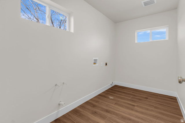 578 West 7th Midvale, UT 84047 - Photo 10 of 35 Laundry area with washer hookup, wood finished floors, gas dryer hookup, and electric dryer hookup
