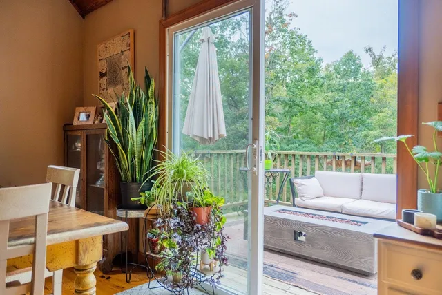 a bedroom with a bed and a night stand