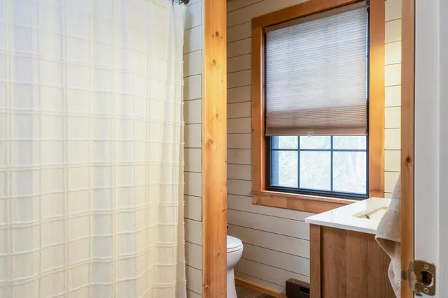 a bedroom with a bed and a table in it