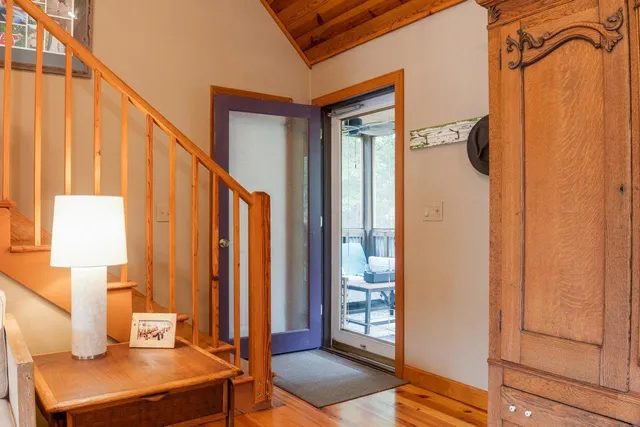 a living room with furniture a fireplace and a table