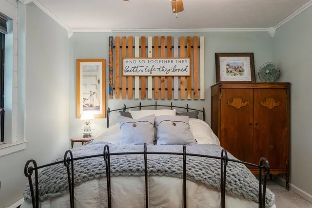 a view of a house with a yard and sitting area