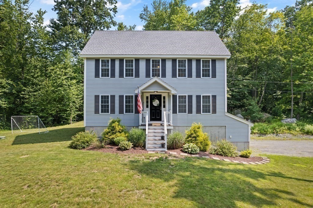 299 Allen Road Ashby, MA 01431 - Photo 1 of 26 front view of a house with a yard