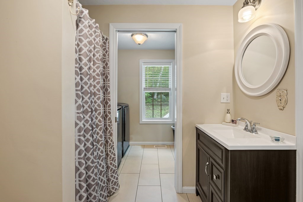 299 Allen Road Ashby, MA 01431 - Photo 20 of 26 a bathroom with a sink a toilet and a mirror