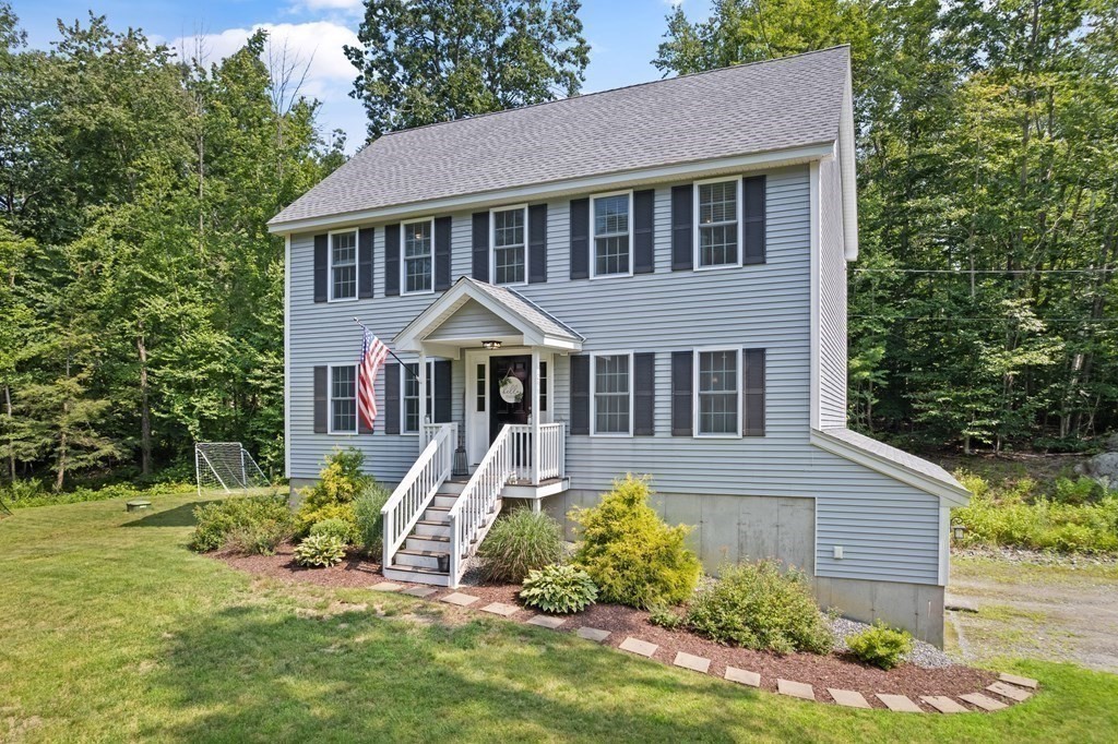 299 Allen Road Ashby, MA 01431 - Photo 3 of 26 a front view of a house with a yard