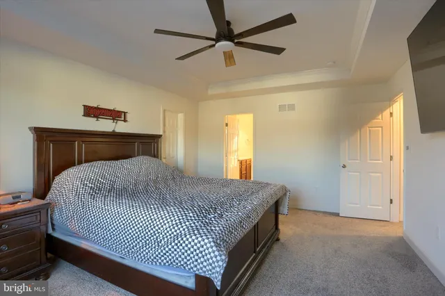 a bathroom with a sink vanity and mirror