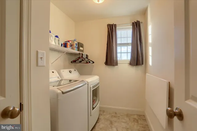 a kitchen with a sink and wooden cabinets