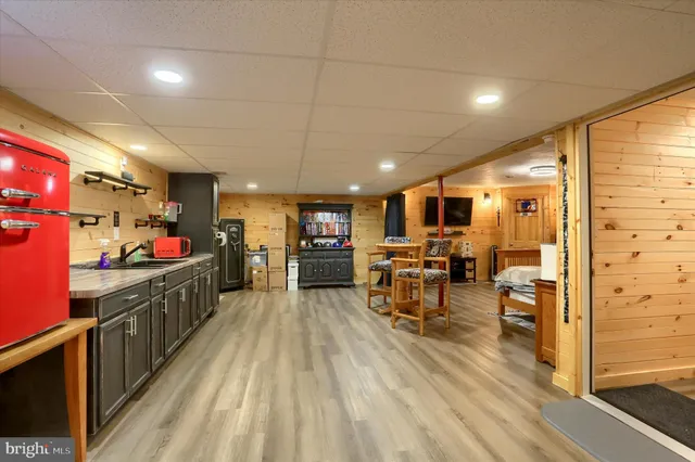 a view of a livingroom with furniture and a flat screen tv