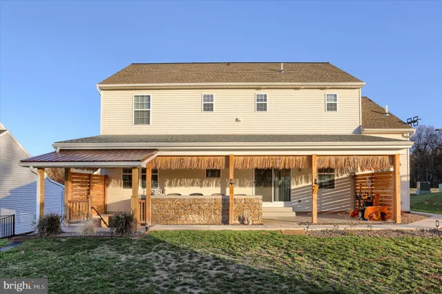 a view of a porch with a table and chairs