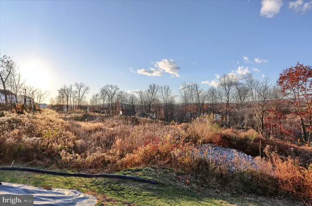 an aerial view of a house with a swimming pool