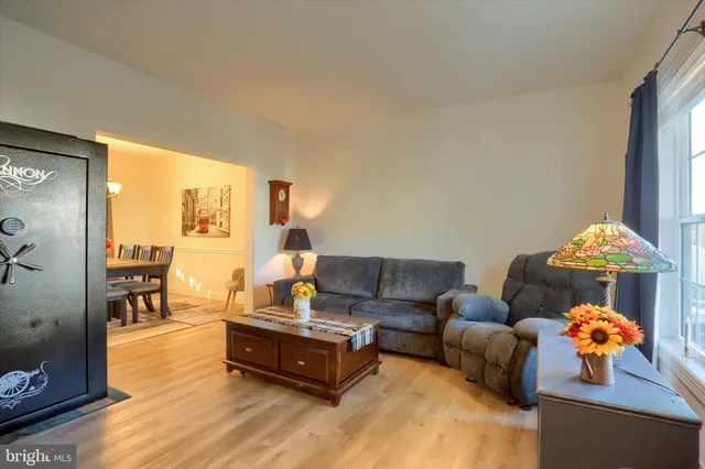 a living room with furniture and a table