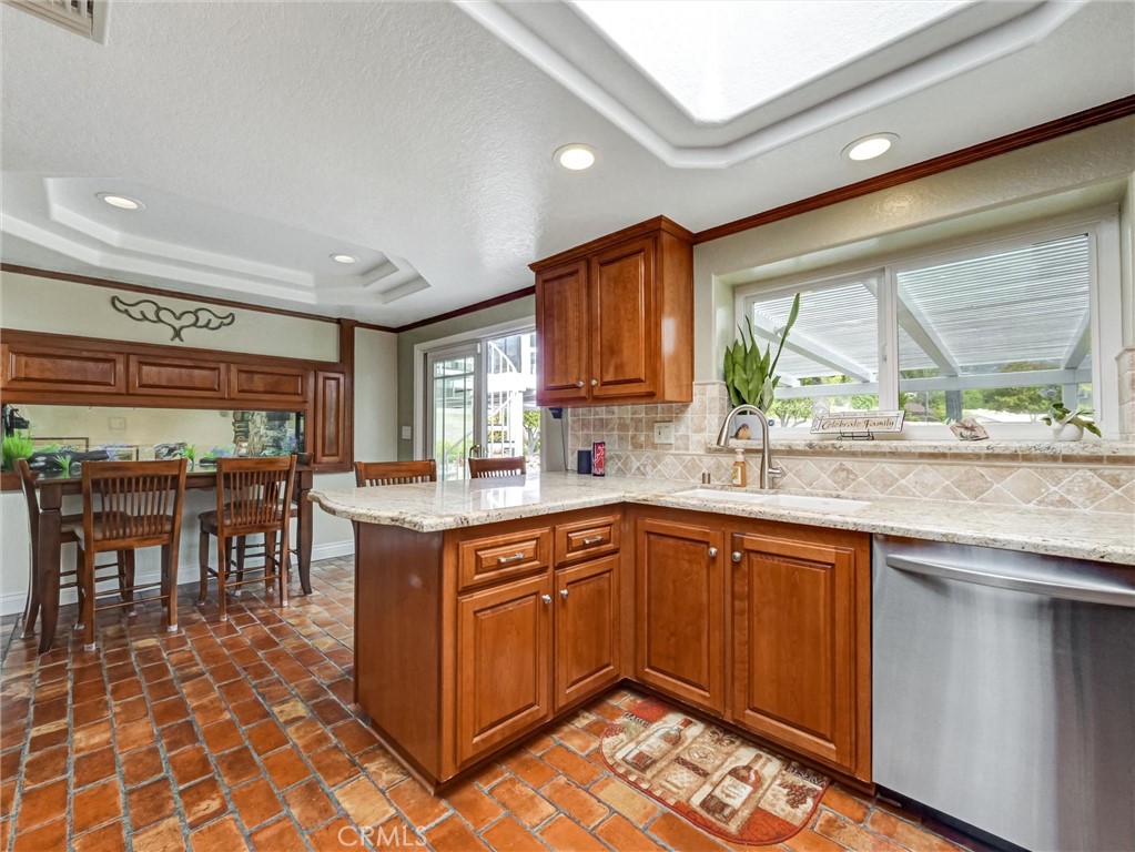 5831 Moonstone Avenue Rancho Cucamonga, CA 91701 - Photo 17 of 61 a kitchen with a sink counter top space and appliances