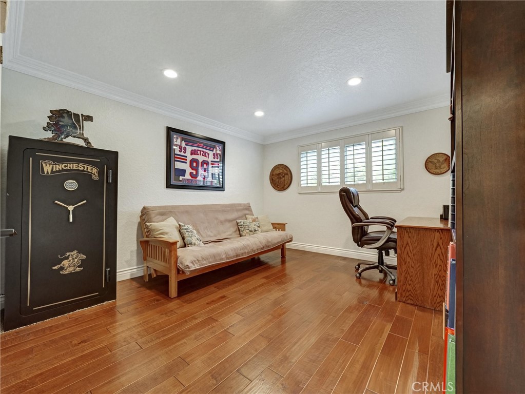 5831 Moonstone Avenue Rancho Cucamonga, CA 91701 - Photo 23 of 61 a living room with furniture and wooden floor