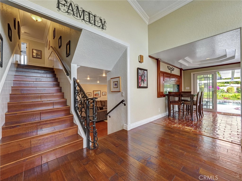 5831 Moonstone Avenue Rancho Cucamonga, CA 91701 - Photo 28 of 61 a view of entryway and dining room with wooden floor