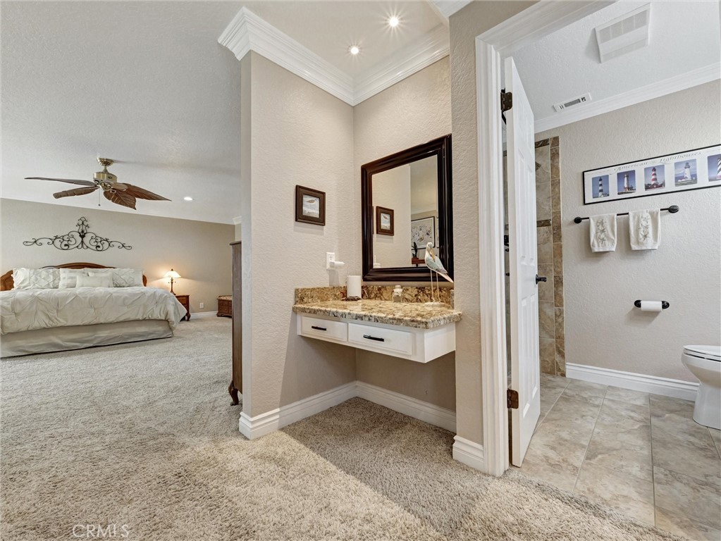 5831 Moonstone Avenue Rancho Cucamonga, CA 91701 - Photo 36 of 61 a en suite bathroom with a sink and a toilet