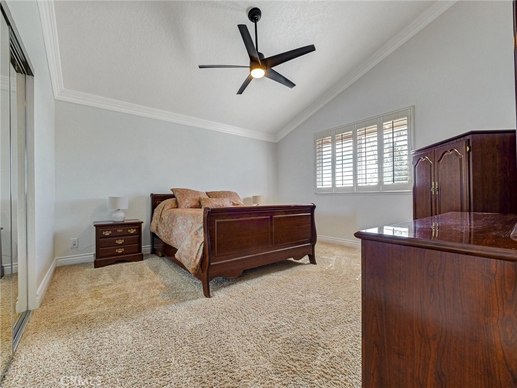 5831 Moonstone Avenue Rancho Cucamonga, CA 91701 - Photo 44 of 61 a bedroom with a bed and a dresser in it