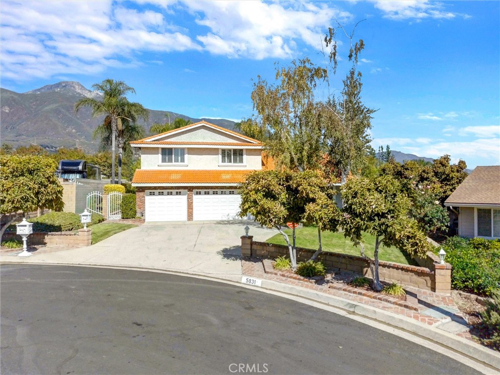 5831 Moonstone Avenue Rancho Cucamonga, CA 91701 - Photo 54 of 61 front view of a house with a street