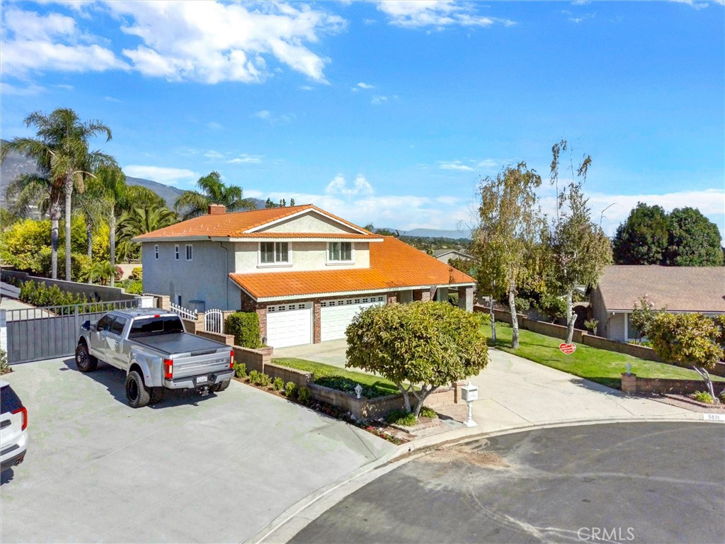 5831 Moonstone Avenue Rancho Cucamonga, CA 91701 - Photo 55 of 61 a car parked in front of a house