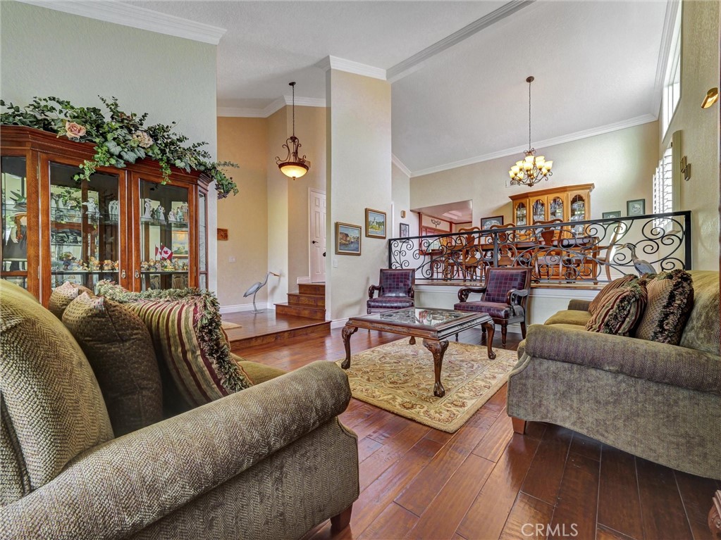 5831 Moonstone Avenue Rancho Cucamonga, CA 91701 - Photo 8 of 61 a living room with furniture chandelier and a chandelier