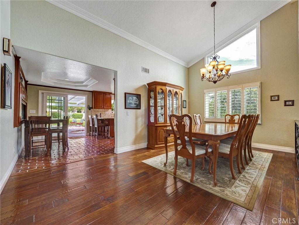 5831 Moonstone Avenue Rancho Cucamonga, CA 91701 - Photo 9 of 61 a view of a dining room with furniture window and wooden floor