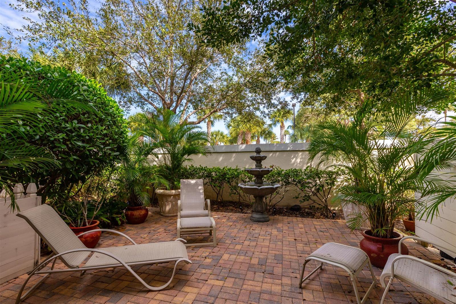 1000 North Us Highway, Unit 809 Jupiter, FL 33477 - Photo 12 of 30 a view of backyard with outdoor seating and plants