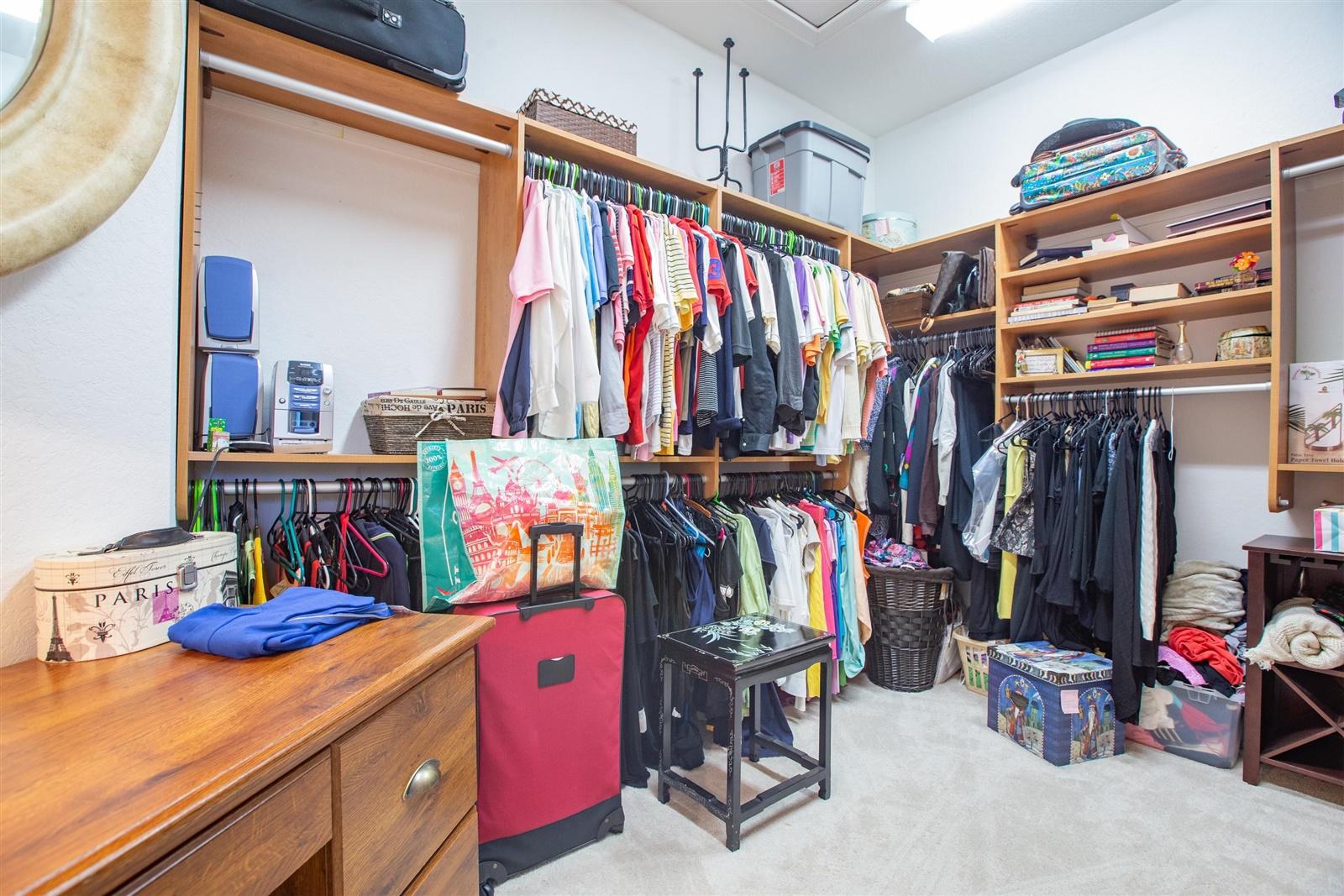 1000 North Us Highway, Unit 809 Jupiter, FL 33477 - Photo 18 of 30 a view of walk in closet with clothes and shoes