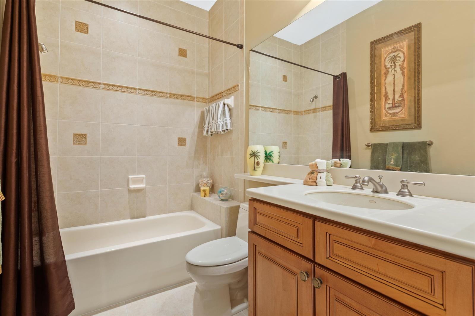 1000 North Us Highway, Unit 809 Jupiter, FL 33477 - Photo 20 of 30 a bathroom with a sink a toilet and shower