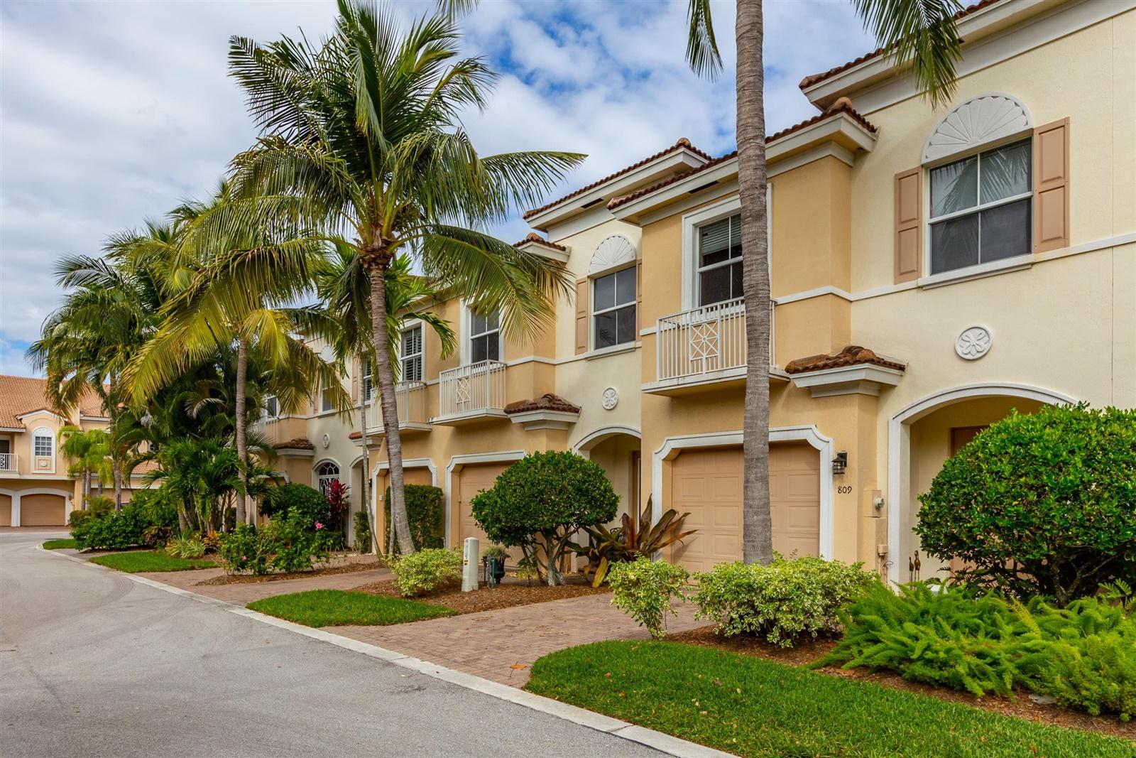 1000 North Us Highway, Unit 809 Jupiter, FL 33477 - Photo 3 of 30 a front view of a multi story residential apartment building with yard and parking