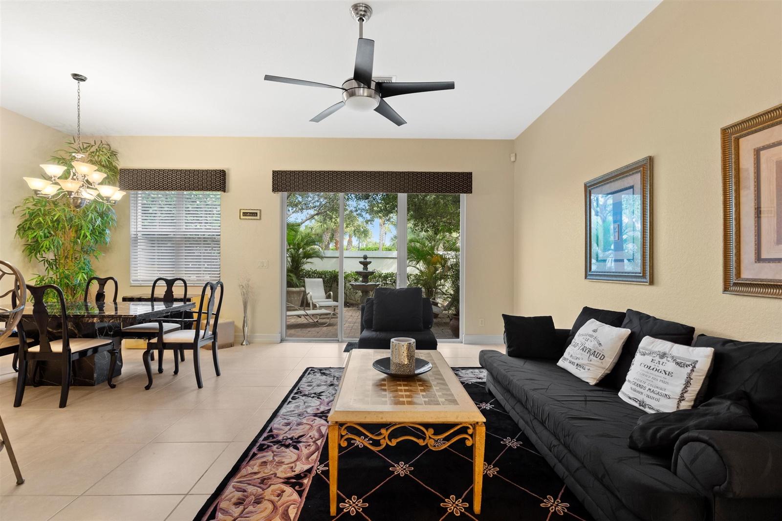 1000 North Us Highway, Unit 809 Jupiter, FL 33477 - Photo 8 of 30 a living room with furniture and a large window