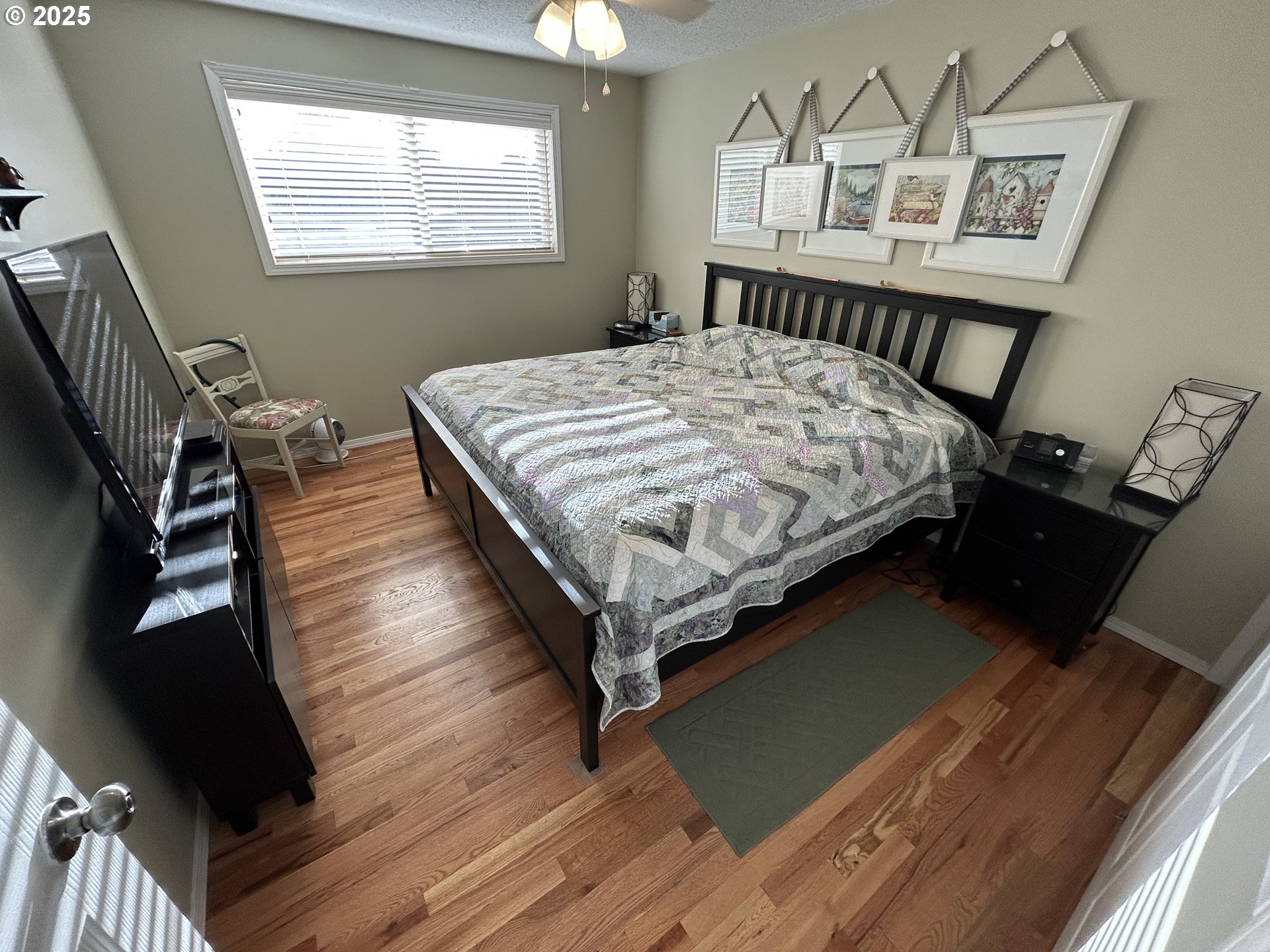 1753 Jansen Way Woodburn, OR 97071 - Photo 11 of 17 a bed sitting in a bedroom next to a window