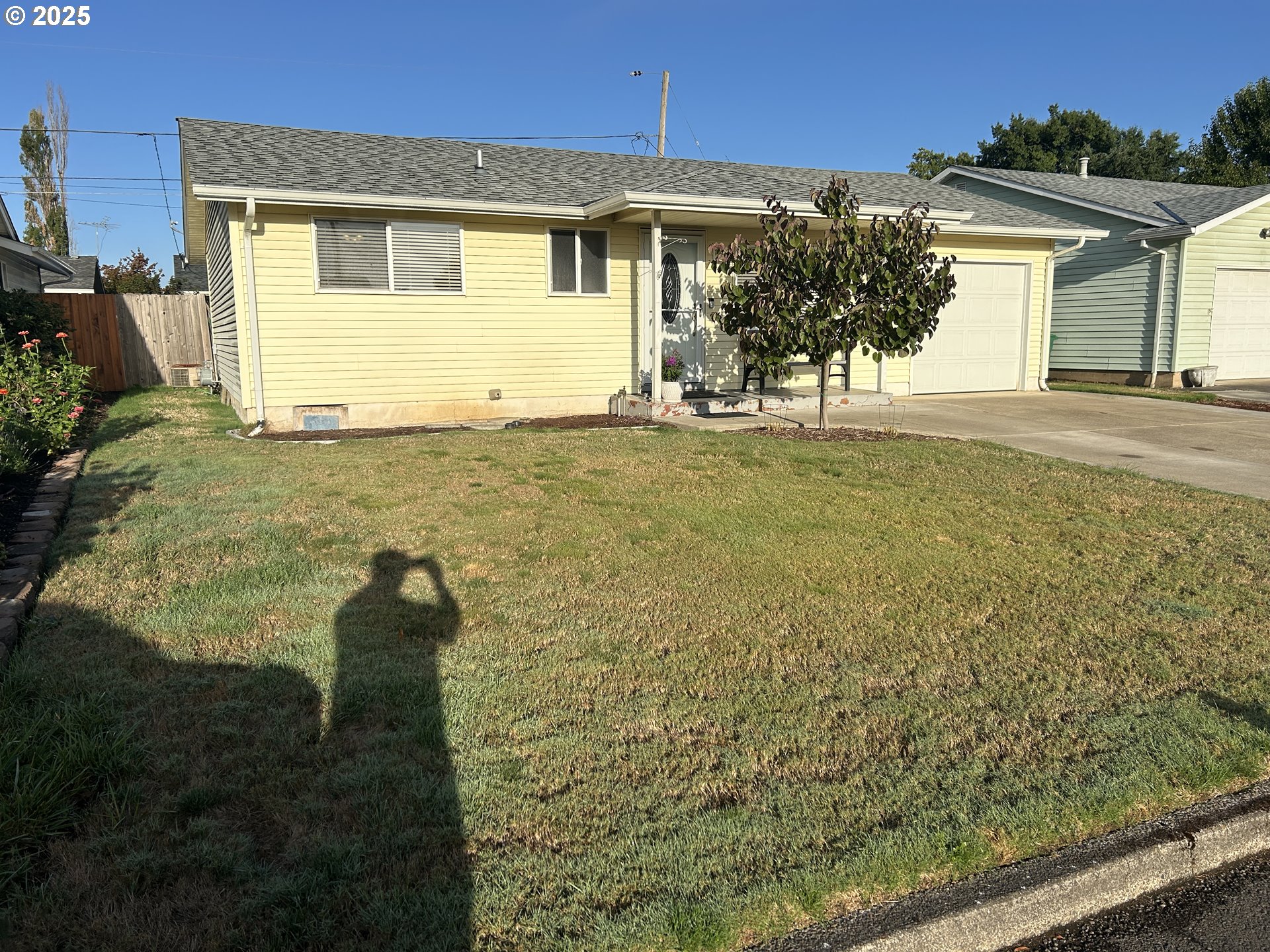 1753 Jansen Way Woodburn, OR 97071 - Photo 2 of 17 a front view of a house with garden
