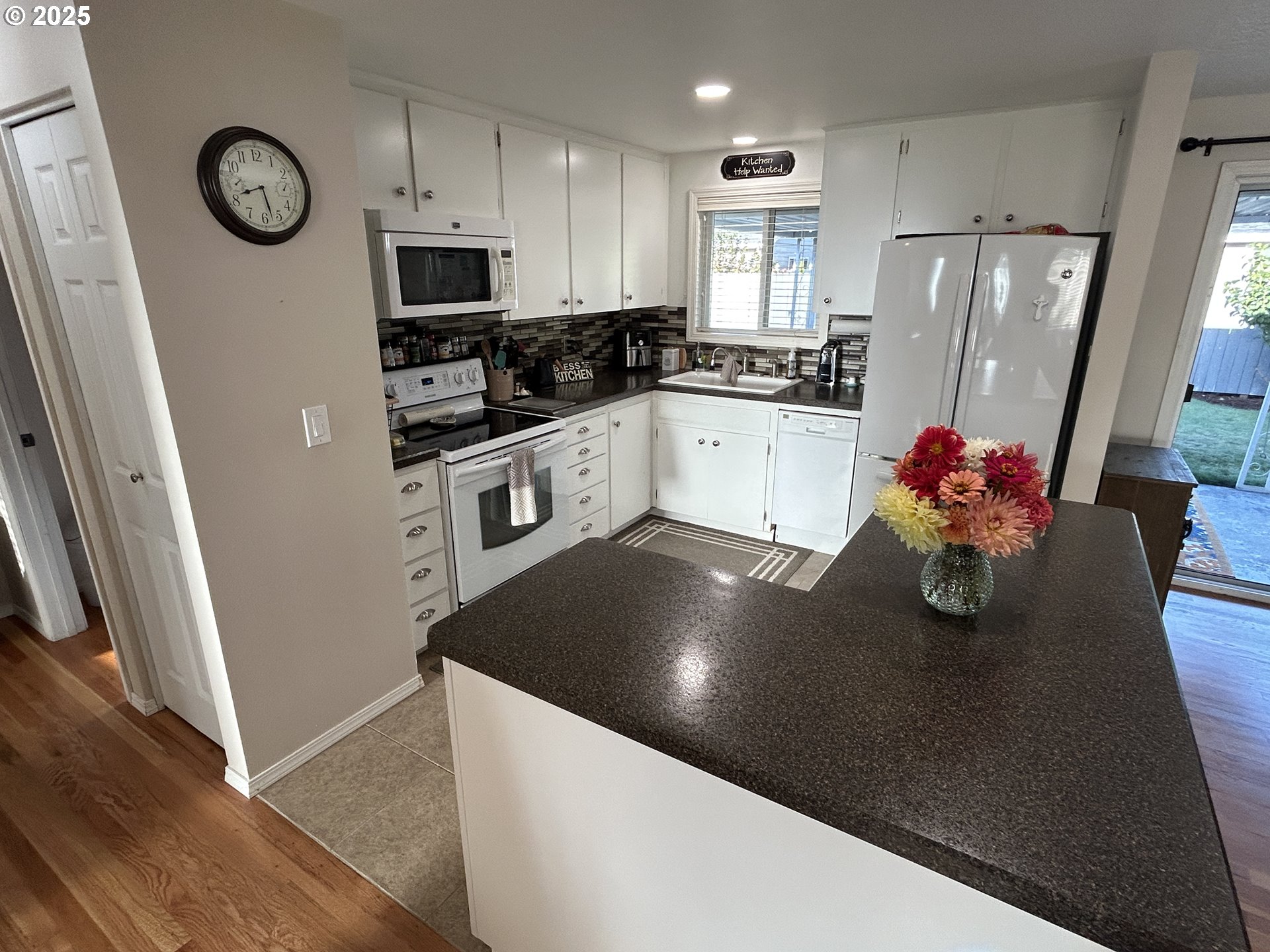1753 Jansen Way Woodburn, OR 97071 - Photo 5 of 17 a kitchen with stainless steel appliances a refrigerator sink and microwave
