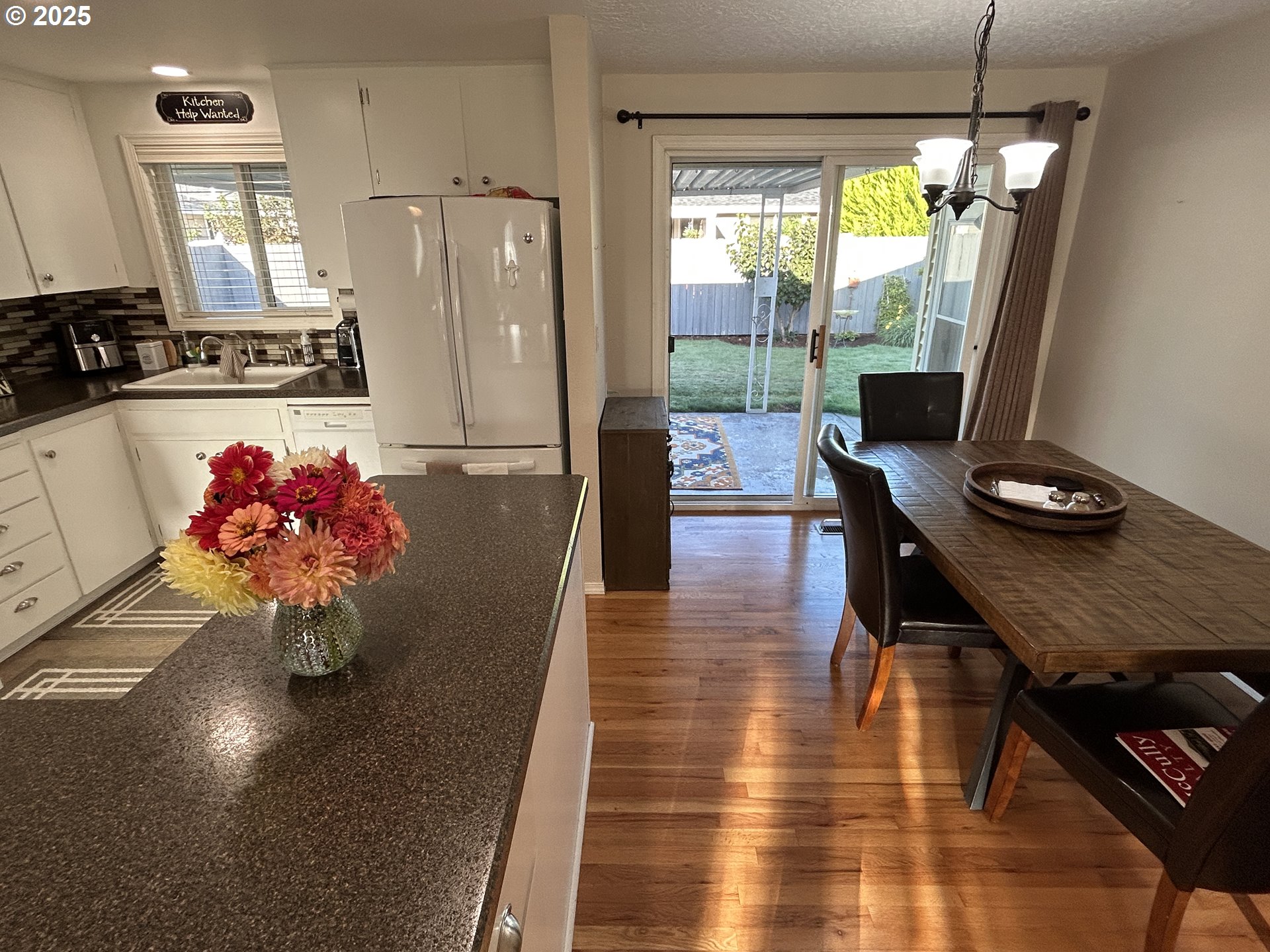 1753 Jansen Way Woodburn, OR 97071 - Photo 7 of 17 a kitchen with a refrigerator and a stove