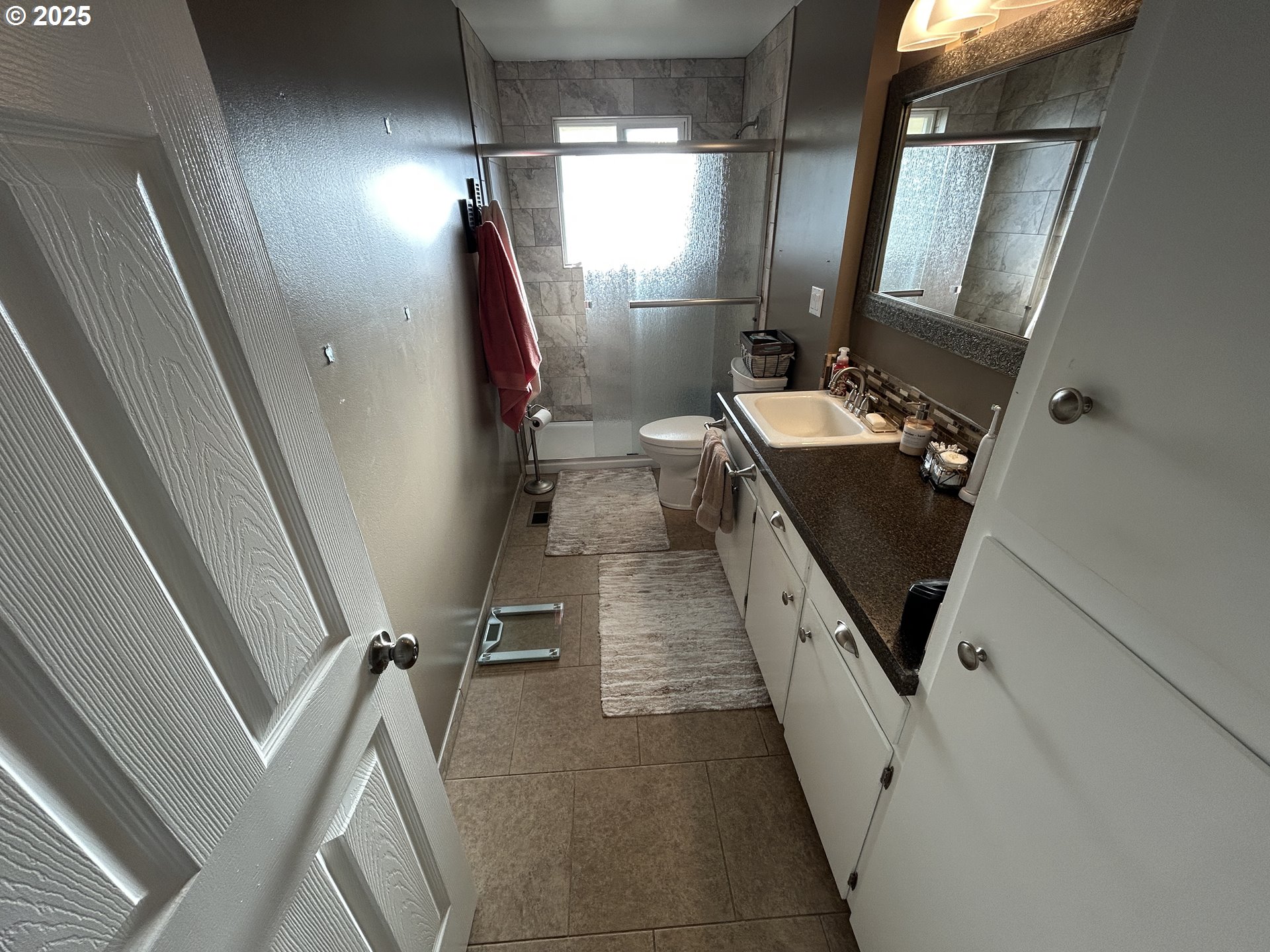 1753 Jansen Way Woodburn, OR 97071 - Photo 8 of 17 a bathroom with sink mirror vanity and toilet