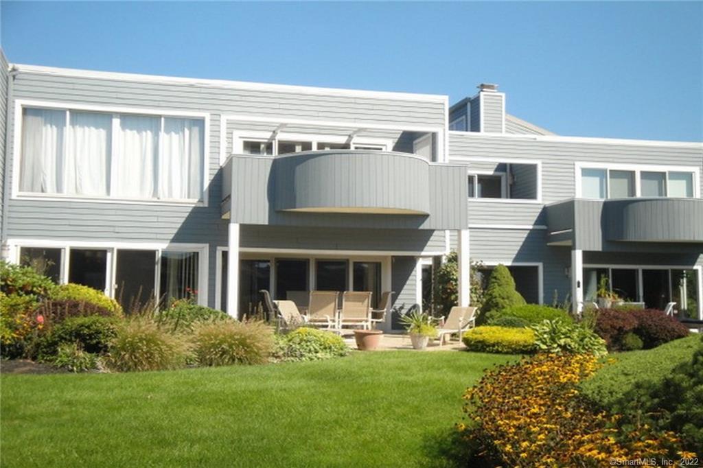 2 Oyster Landing Road, Unit 2 Milford, CT 06460 - Photo 1 of 1 a front view of a house with a garden and porch