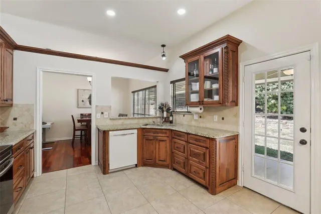 a kitchen with a sink and a refrigerator