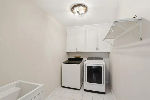 a view of a kitchen with washer and dryer