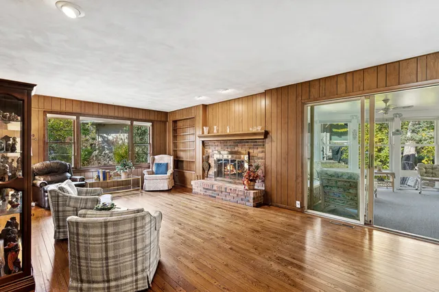 a bedroom with two beds and painted walls