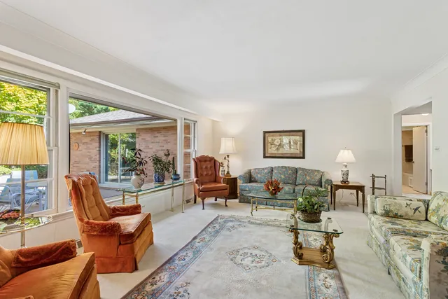 a bedroom with a large bed and a large window