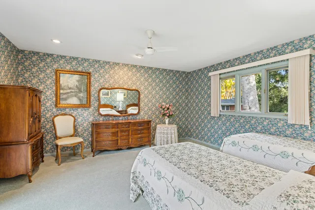 a view of a patio with table and chairs and potted plants