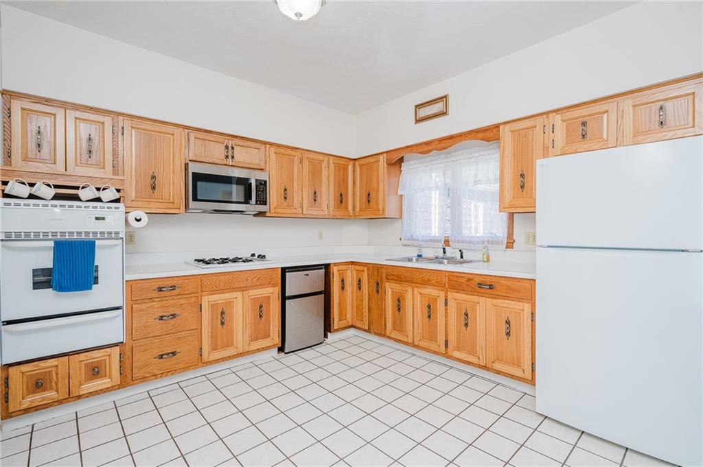 408 Indiana Road Creekside, PA 15732 - Photo 17 of 34 a kitchen with stainless steel appliances granite countertop a refrigerator sink and stove