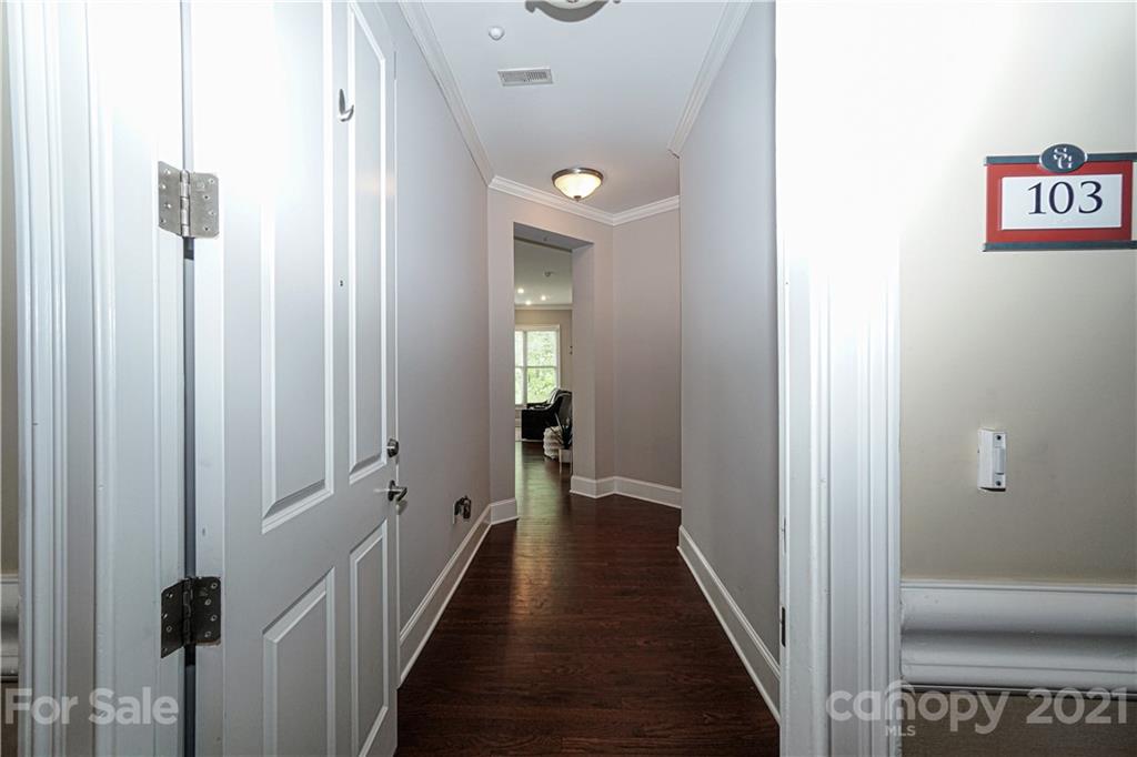 5425 Closeburn Road, Unit 103 Charlotte, NC 28210 - Photo 2 of 39 a view of a hallway with wooden floor